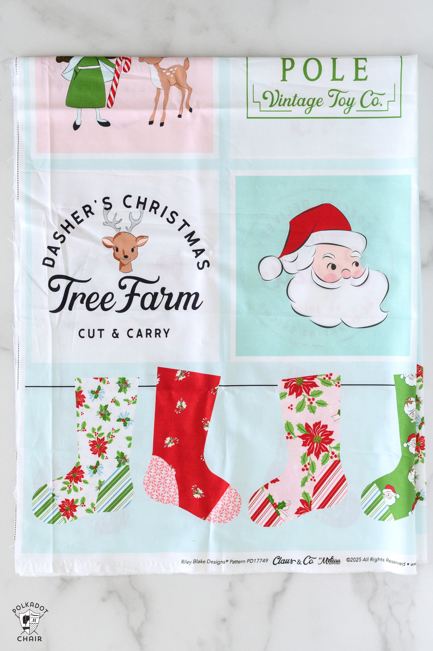 Vintage-style Christmas-themed fabric with printed designs on a white background
