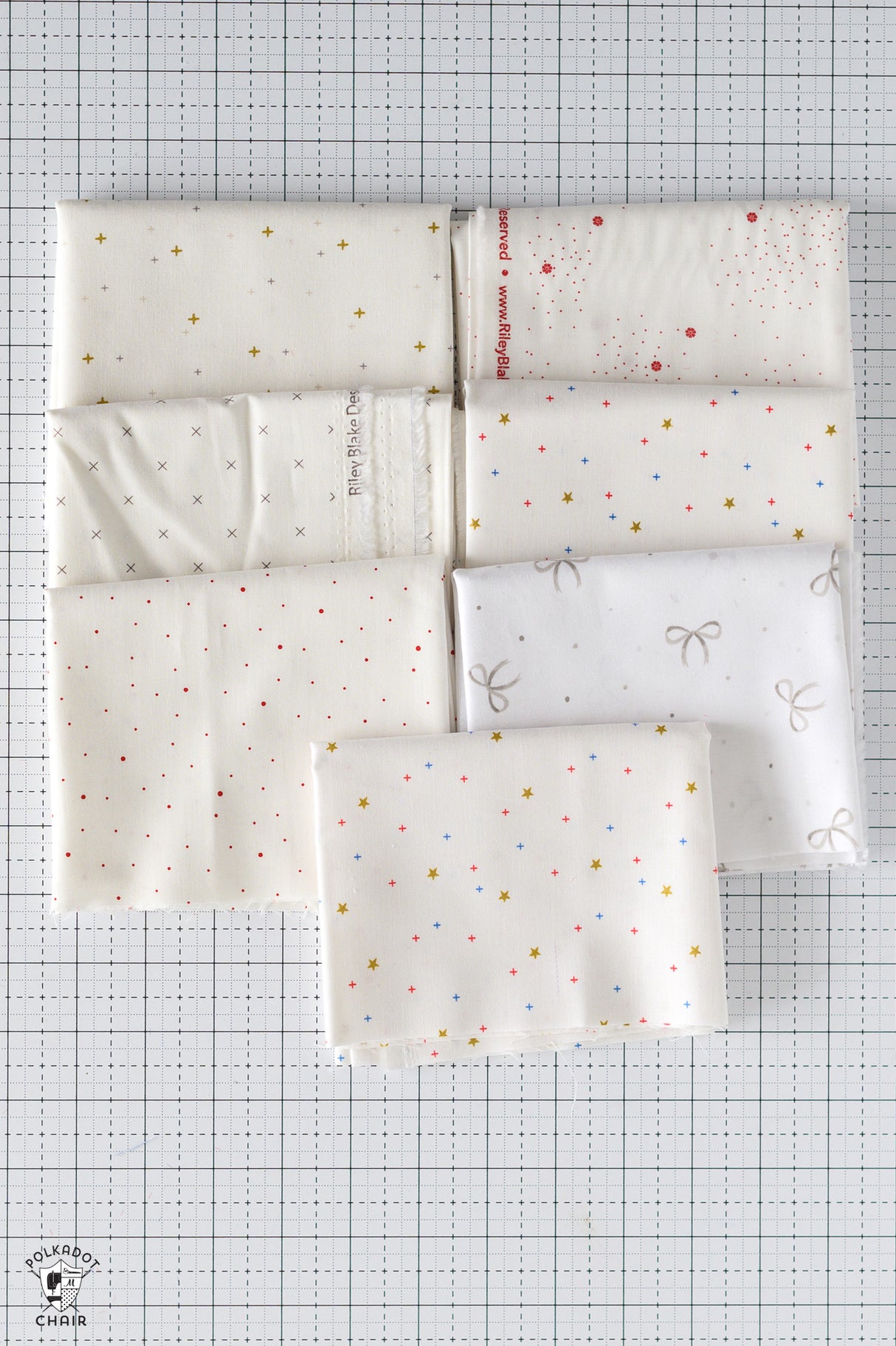 Set of white fabric swatches with patterns on a grid background