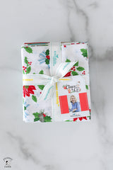 Packaged product with Christmas-themed design on a marble surface