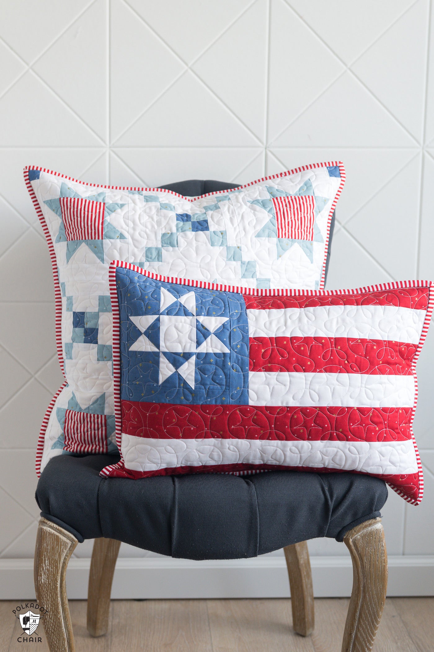 Quilted pillow with American flag design on a chair against a white wall.