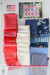 Collection of red, white, and blue fabric swatches on a grid background with a quilt pattern poster.