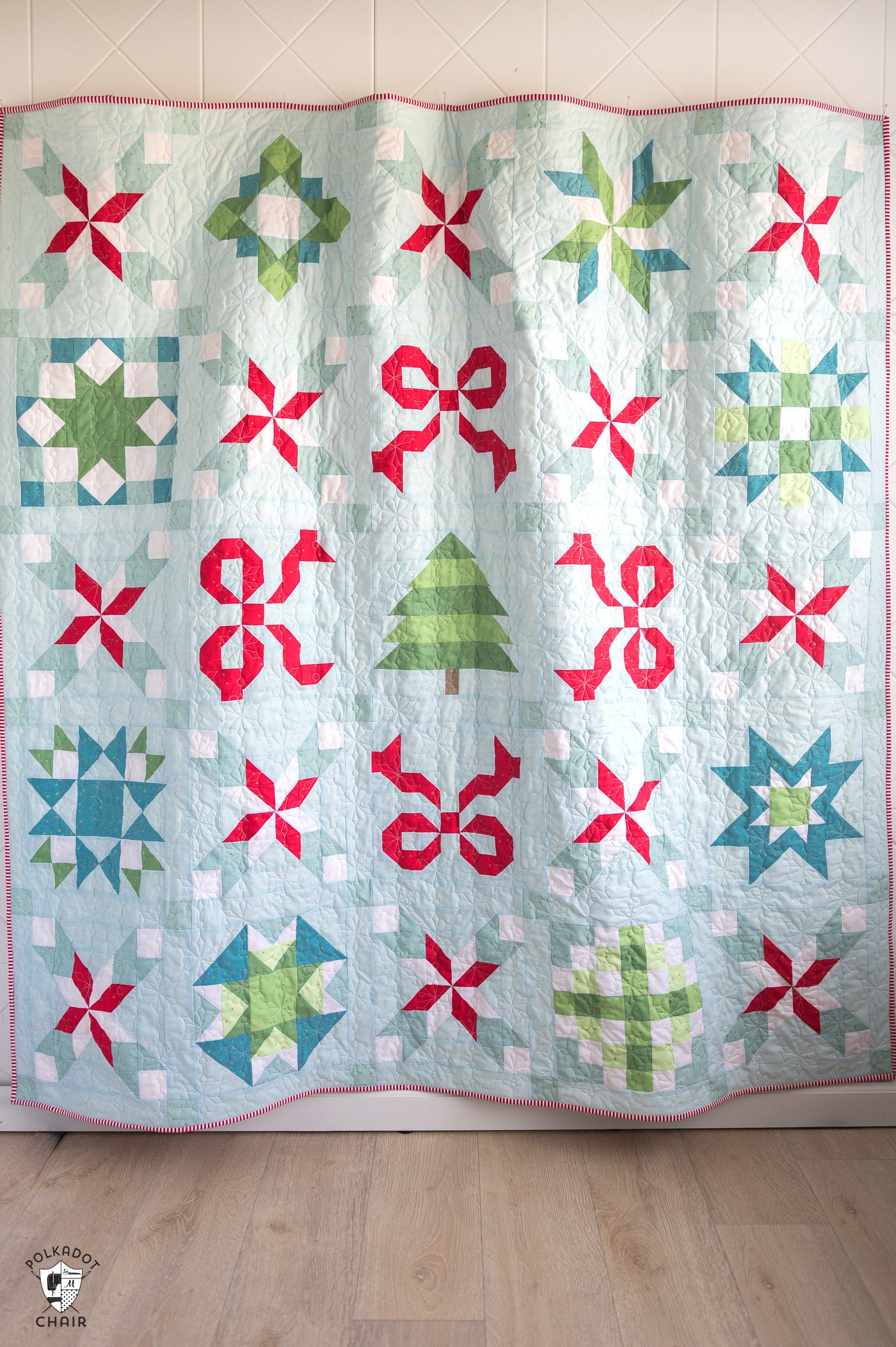 Colorful quilt with geometric patterns on a wooden floor